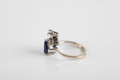 White gold ring set with a pear-cut sapphire...