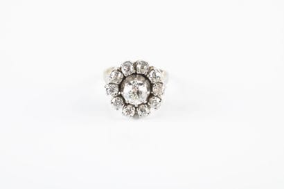 Gold and platinum ring holding one old-cut...