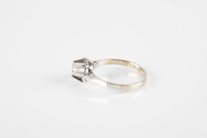 Gold and platinum solitaire ring set with...
