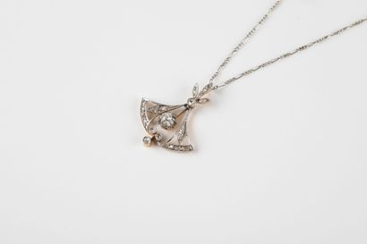 Figaro chain in platinum holding a yellow...