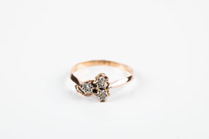 Pink gold ring featuring three stars set...