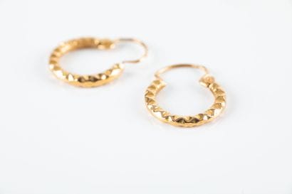 Pair of creole earrings in yellow gold with...