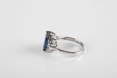 White gold ring set with a certified oval...