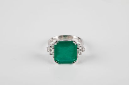 White gold ring set with a large emerald...