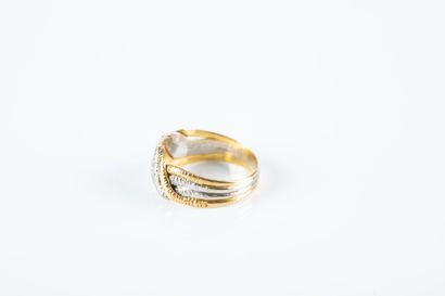 Yellow and white gold ring holding 4 intertwined...