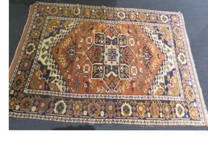 Iranian carpet on a brick background and...