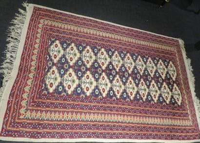 Woolen carpet with knotted stitches decorated...