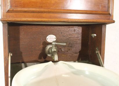 Cabin sink in blond mahogany. Zinc water...