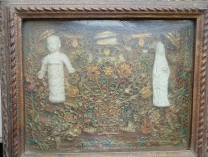 Frame of polychrome and gilded paperolles...