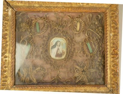 Paperolles reliquary frame with a central...