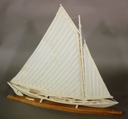 Model of a bone whaleboat shown under sail....