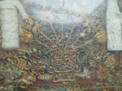 Frame of polychrome and gilded paperolles...