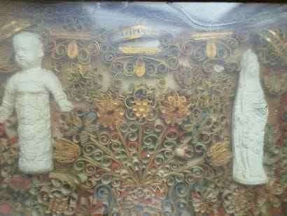 Frame of polychrome and gilded paperolles...