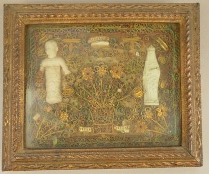 Frame of polychrome and gilded paperolles...