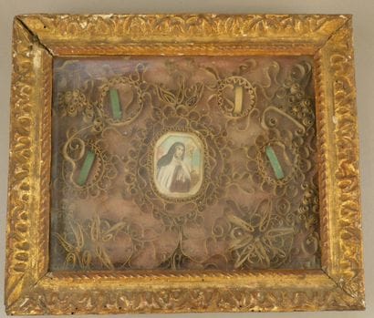 Paperolles reliquary frame with a central...