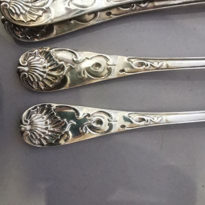 SERIES OF ELEVEN COUVERTS AND A FISH FOURCHETTE...