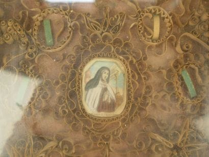 Paperolles reliquary frame with a central...