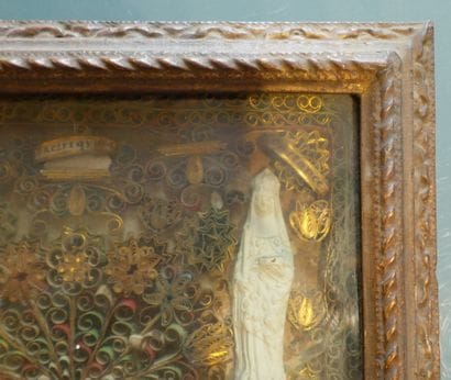 Frame of polychrome and gilded paperolles...