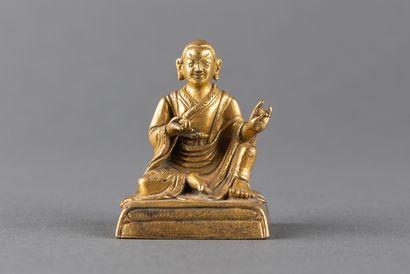 Small statuette of Lhama shown seated in...