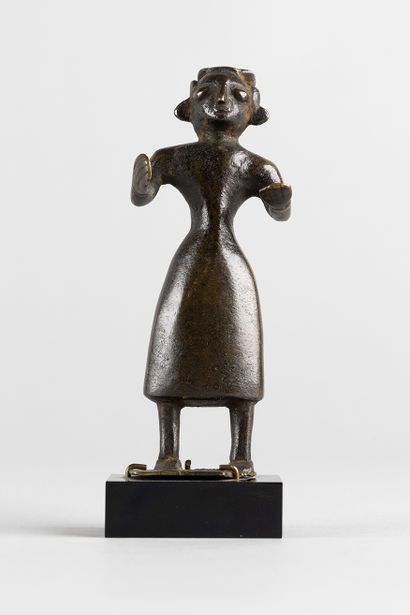 Standing figure with open arms. Bronze with...