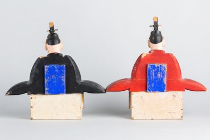Two dolls representing the minister on the...