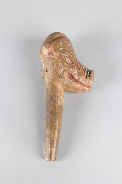 Old puppet head representing a pig. Wood,...