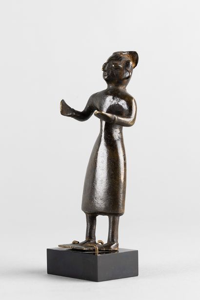 Standing figure with open arms. Bronze with...