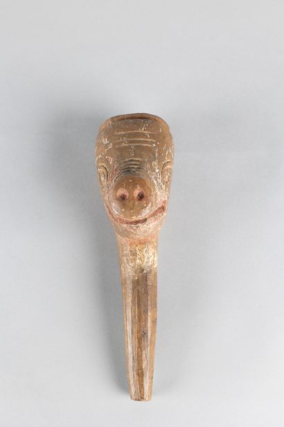 Old puppet head representing a pig. Wood,...