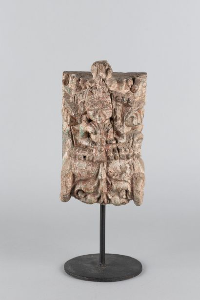 Relief depicting a figure surrounded by horses....