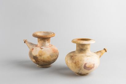 Two vessels with long spouts. Ceramic, trace...