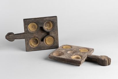 Two antique temple candle trays. Heavy wood...