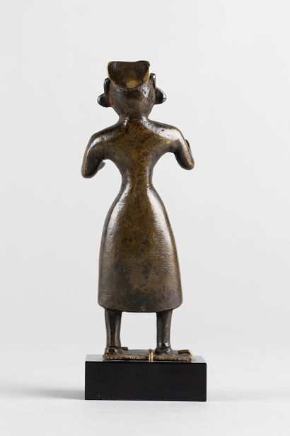 Standing figure with open arms. Bronze with...