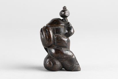 Statuette representing one of the seven Gods...