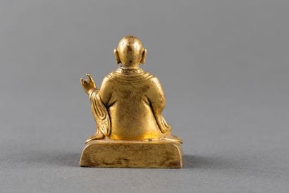 Small statuette of Lhama shown seated in...