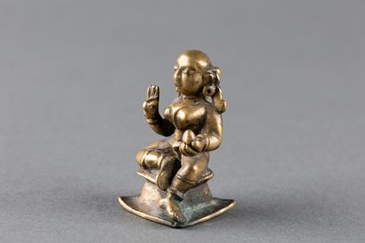 Female divinity seated on a pedestal. Patinated...