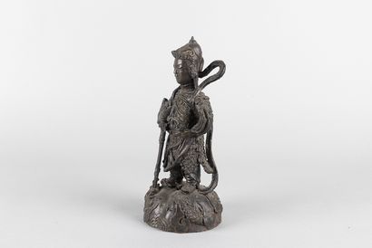 Wei two. Statue of a warrior god standing...