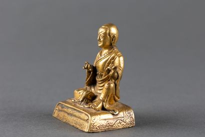 Small statuette of Lhama shown seated in...