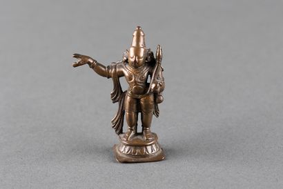Male divinity standing on a pedestal. Patinated...