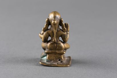 Female divinity seated on a pedestal. Patinated...