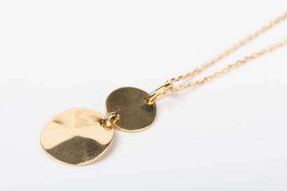 Yellow gold forcat chain with a pendant holding...