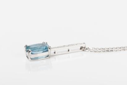 White gold chain holding a baguette pendant...