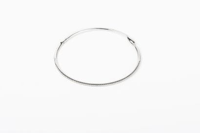 Openwork white gold bangle set with a line...