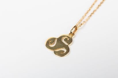 Yellow gold forcat chain with triskel pendant...