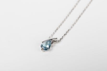 White gold forcat chain holding a cross pendant...