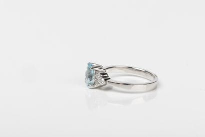 White gold ring adorned with an oval aquamarine...
