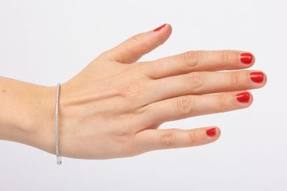 Openwork white gold bangle set with a line...