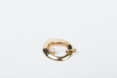Yellow gold pendant set with a cultured pearl...