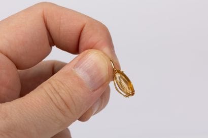 Yellow gold pendant set with a navette-cut...