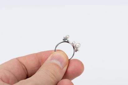 White gold lotus leaf ring set with four...