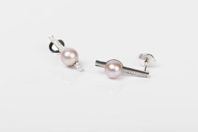 Pair of white gold barette earrings set with...